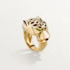 Δαχτυλίδι Panthere De Cartier – Κίτρινο χρυσό, λάκα, γρανάτης τσαβορίτης, όνυχας – Cartier